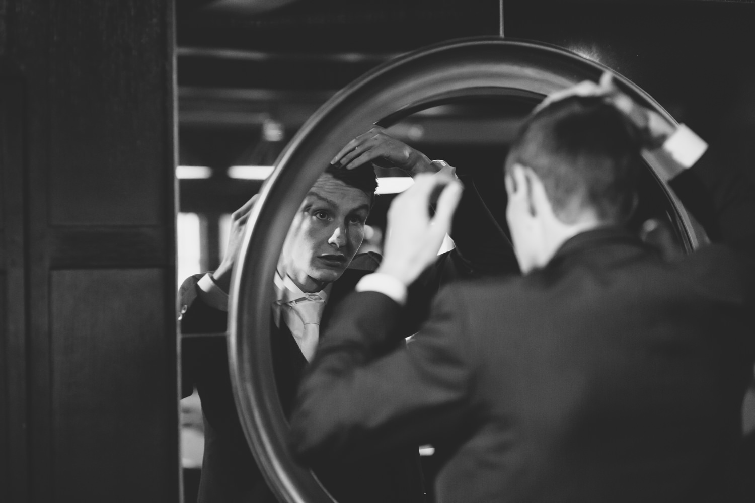 Groom in mirror