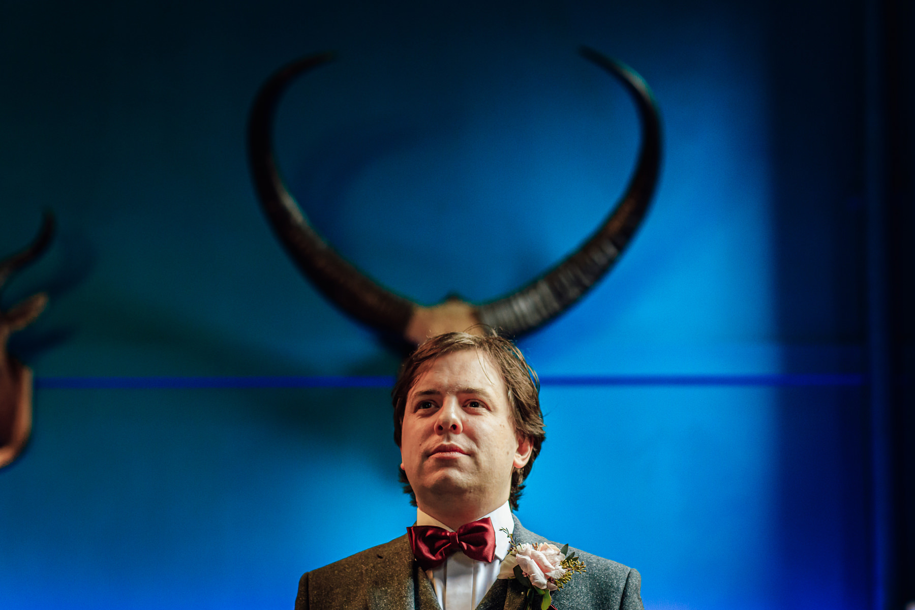 groom standing under horns at ruthin castle