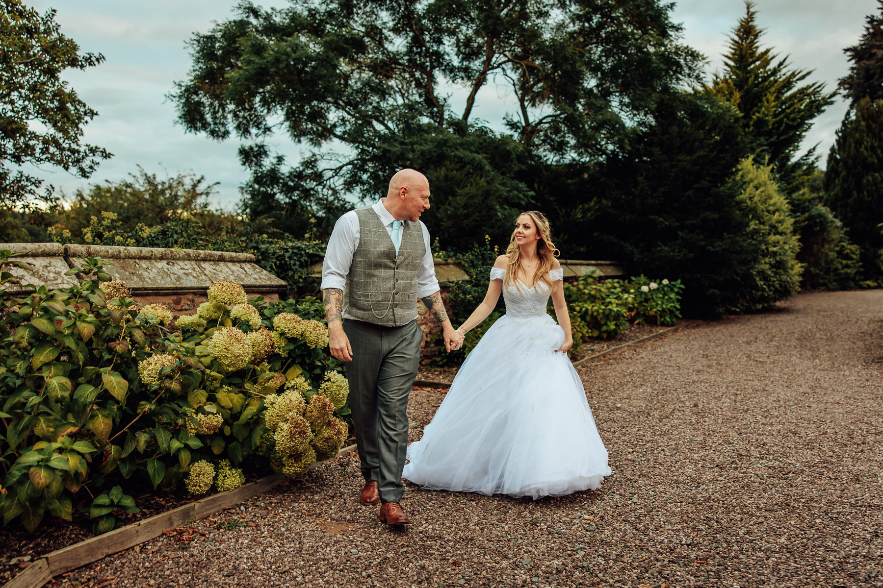 bride and groom in gardens of Rowton Castle