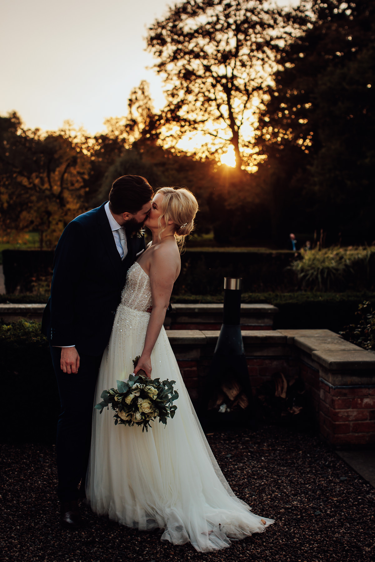 Portrait of bride and groom in sunset