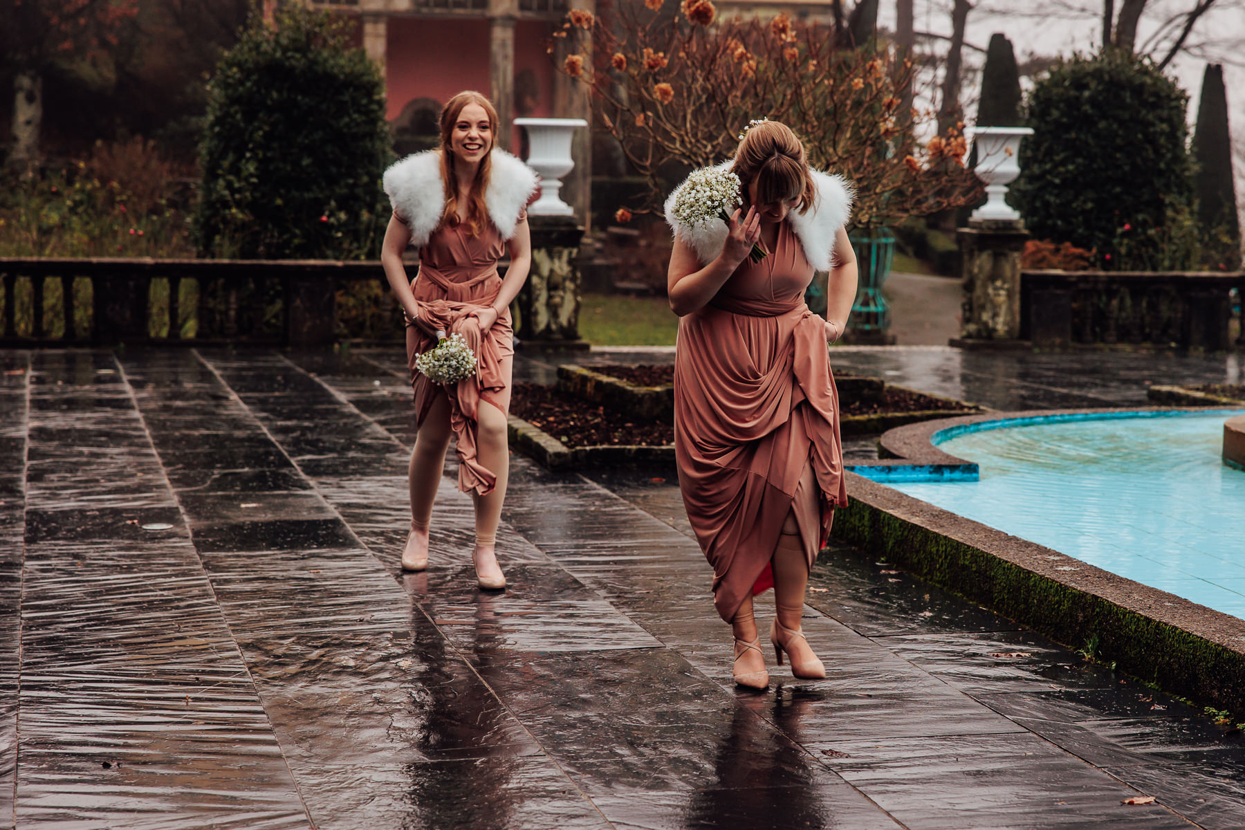 bridesmaids walking in the rain
