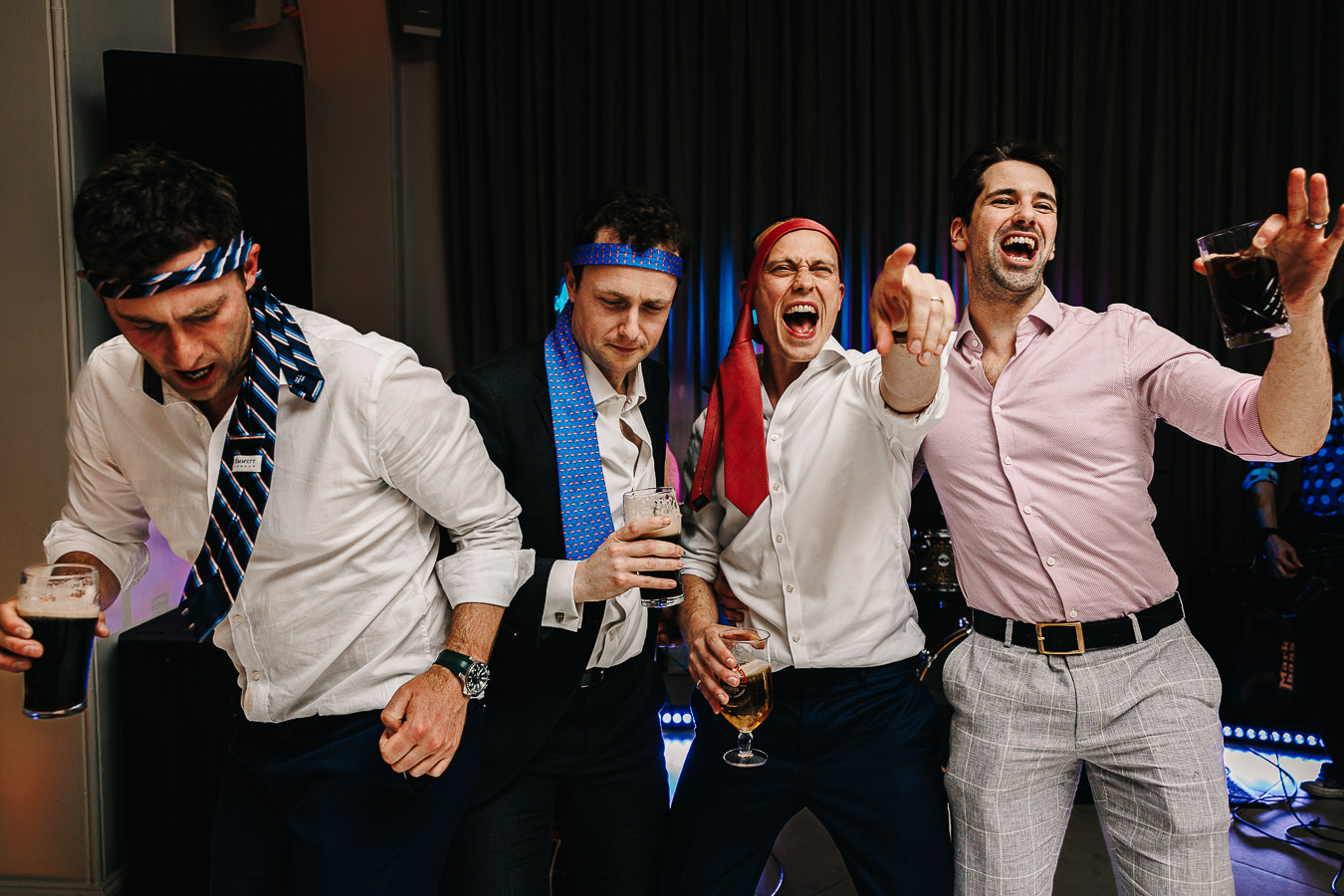 Guests dancing with ties on their heads