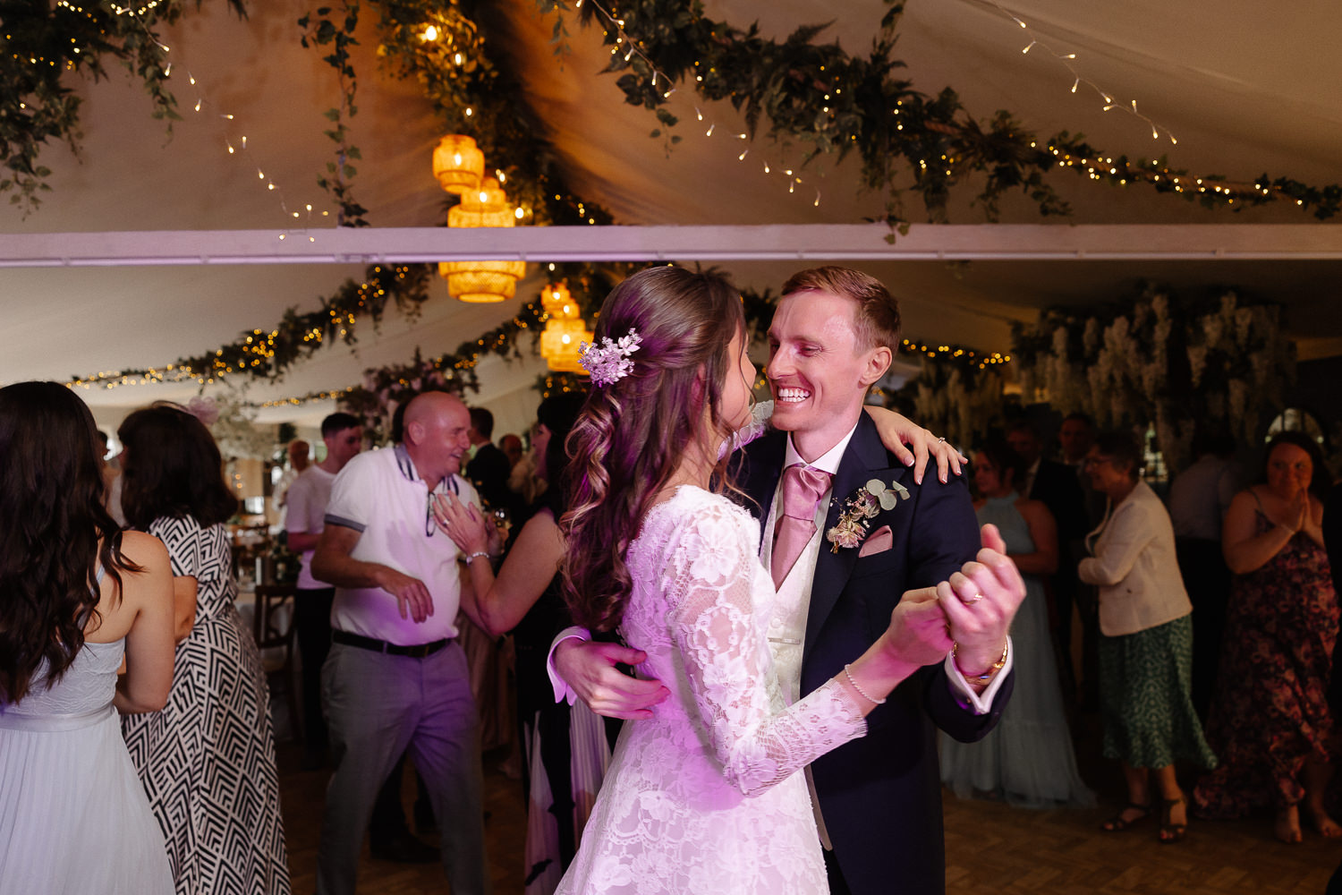 a man and woman dancing in a tent