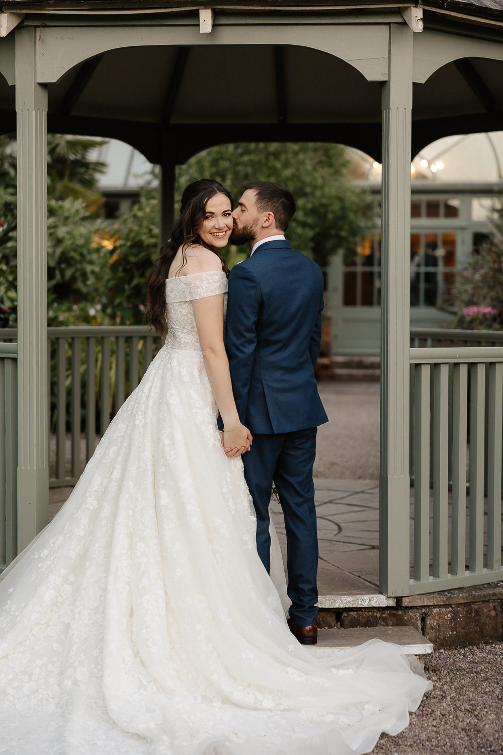a groom and bride in a wedding dress